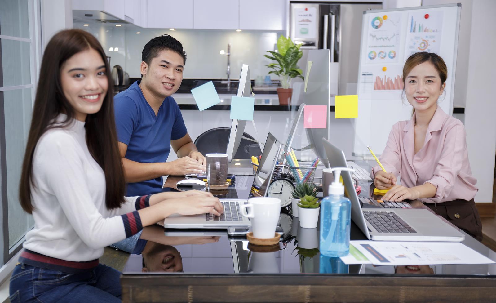 Asian small business startup multiracial working with laptop and